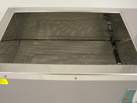 Showing the protective mesh covering the heating element inside a Ratek WB14 Waterbath